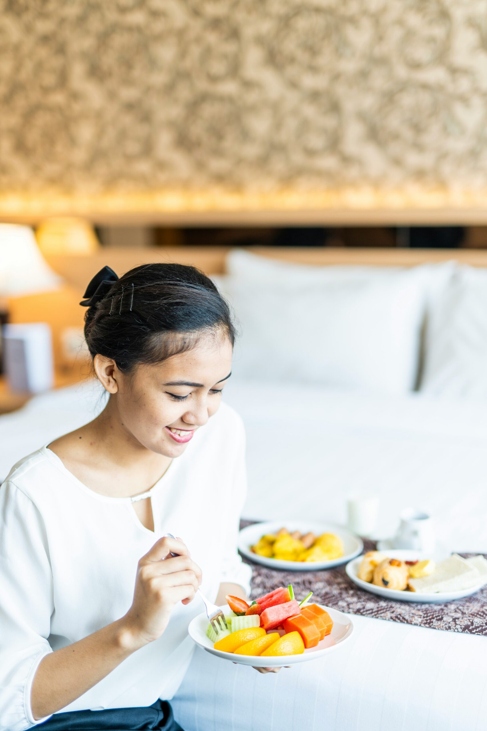 woman with plate of fruit